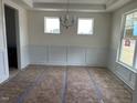 Bright dining room with white trim, wainscoting, and plenty of natural light at 266 Weddington Way, Benson, NC 27504