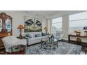 Spacious living room with hardwood floors, large windows, and comfortable seating at 400 W North St # 820, Raleigh, NC 27603