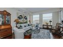Elegant living room with hardwood floors, comfortable seating, and large artwork at 400 W North St # 820, Raleigh, NC 27603