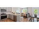 Open concept kitchen with granite counters and stainless steel appliances at 442 Belgian Red Way, Wake Forest, NC 27587