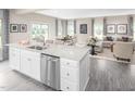 Spacious kitchen with a breakfast bar overlooking a dining area and living room with natural lighting at 532 Freedom Trail Dr, Willow Springs, NC 27592