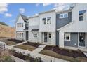 Three-unit townhouse building, gray and white siding at 602 Hillfarm Dr, Wake Forest, NC 27587