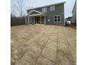 Backyard features a covered porch and newly laid sod at 9349 Kitchin Farms Way # 463, Wake Forest, NC 27587
