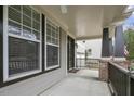Charming front porch with ceiling fan, brick columns, and views of the neighborhood at 108 Cross Oaks Pl, Holly Springs, NC 27540