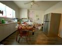 Simple kitchen with cabinets, appliances, and a dining table at 1124 S Church St, Rocky Mount, NC 27803