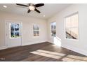 Bright living room with hardwood floors and neutral walls at 1127 Elmo St, Durham, NC 27701