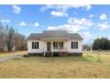 Ranch style home with a large yard and driveway at 131 Morgan Pkwy, Zebulon, NC 27597