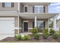 Front porch with stone accents and a welcome sign at 148 Cumberland Dr, Sanford, NC 27332