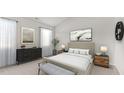 Spacious bedroom with large windows and neutral decor at 155 Scenic Rock Dr, Youngsville, NC 27596