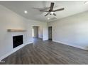 Bright living room boasts wood floors, fireplace, ceiling fan, and recessed lighting, ready for your personal touch at 286 Longbow Dr, Middlesex, NC 27557