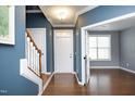 Bright and airy entryway with hardwood floors and staircase at 36 Aster Ln, Pittsboro, NC 27312