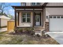 Inviting front porch with stone accents, stylish columns, and a well-maintained entrance, adding curb appeal at 112 1St St, Oxford, NC 27565