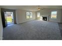 Spacious living room with fireplace, vaulted ceiling, and hardwood floors at 120 Magnolia Run Way, Benson, NC 27504