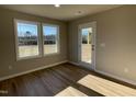 Bright office with large windows and wood-look flooring at 125 Hydrangea Ln, Benson, NC 27504