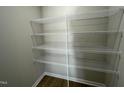 Walk-in pantry with wire shelving for ample storage at 125 Hydrangea Ln, Benson, NC 27504