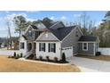 Gray siding two-story house with attached garage and landscaping at 128 S Clearbrook Ct, Angier, NC 27501