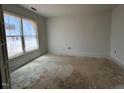 Bright bedroom with ample natural light streaming through the large window at 132 Tennyson Dr, Garner, NC 27529