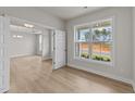 Home office with hardwood floors and a large window offering natural light at 154 Tennyson Dr, Garner, NC 27529