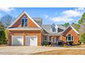 Brick home with two-car garage and landscaped yard at 1801 Amethyst Ridge Dr, Raleigh, NC 27604