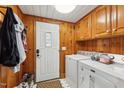 Laundry room with washer, dryer, cabinets, and built in storage at 253 Ronald Tharrington Rd, Louisburg, NC 27549