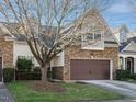 Beautiful 2-story home with stone and siding, landscaping, and a tree at 263 Meadow Beauty Dr, Apex, NC 27539