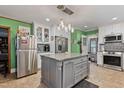 Spacious kitchen with an island, modern appliances, and ample storage space at 302 S Pine St, Benson, NC 27504