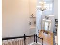 Elegant two-story foyer with hardwood floors and a chandelier at 5240 Indigo Moon Way, Raleigh, NC 27613