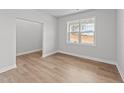 Spacious bedroom with light walls, wood-look floors, and a window at 529 Ravensworth Dr, Garner, NC 27529