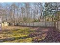 Spacious backyard with a wooden privacy fence at 812 Stinson Ave, Holly Springs, NC 27540