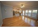 Spacious living room with hardwood floors and a view of the kitchen at 1013 Red Hat Ln, Durham, NC 27713