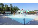 Gathering-friendly splash pad with interactive water features and a pool area for to play at 105 Fountain Ridge Pl, Holly Springs, NC 27540