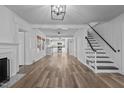 Bright living room features hardwood floors, a fireplace, and an open concept floorplan at 1200 Rogers Rd, Graham, NC 27253