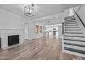 Bright living room features hardwood floors, a fireplace, and an open concept floorplan at 1200 Rogers Rd, Graham, NC 27253