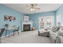 Light and airy living room with fireplace and patio access at 1316 Holly Grove Way, Durham, NC 27713