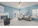 Living room with fireplace and access to back patio at 1316 Holly Grove Way, Durham, NC 27713