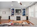 Living room with built-in shelving and fireplace at 1328 Regulator St, Raleigh, NC 27603