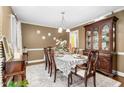 Formal dining room with hardwood floors and a china cabinet at 1699 Yorkshire Ln, Rocky Mount, NC 27803