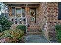 Welcoming front entrance with brick steps and landscaping at 1699 Yorkshire Ln, Rocky Mount, NC 27803
