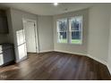 Bright dining area with hardwood floors and views to backyard at 289 Magnolia Run Way, Benson, NC 27504