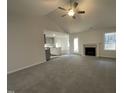 Spacious living room with high ceilings, fireplace, and kitchen views at 289 Magnolia Run Way, Benson, NC 27504