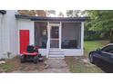 Cozy screened porch with comfortable seating, offering a relaxing outdoor space at 3259 Us 421, Lillington, NC 27546