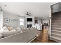 Spacious living room with a fireplace and hardwood floors at 430 Heart Pine Dr, Wendell, NC 27591