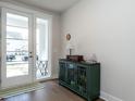 Bright entryway with hardwood floors and a green cabinet at 45 Oatland Pl, Pittsboro, NC 27312