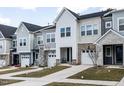 Luxury townhomes featuring attached garages and attractive landscaping at 45 Oatland Pl, Pittsboro, NC 27312