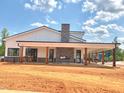 New clubhouse featuring a stone chimney and rustic wooden beams at 115 Siebold St, Garner, NC 27529