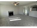 Spacious living room featuring a fireplace and carpet flooring at 171 Wynd Crest Way, Benson, NC 27504