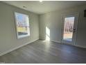 Bright room with hardwood floors and access to backyard at 171 Wynd Crest Way, Benson, NC 27504