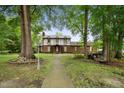 Two-story brick home with walkway and landscaping at 200 Cedarwood Dr, Erwin, NC 28339