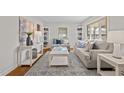 Bright living room with neutral decor and hardwood floors at 2318 Mckinney St, Burlington, NC 27217