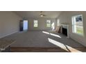 Spacious living room with a fireplace and plenty of natural light at 359 Magnolia Run Way, Benson, NC 27504